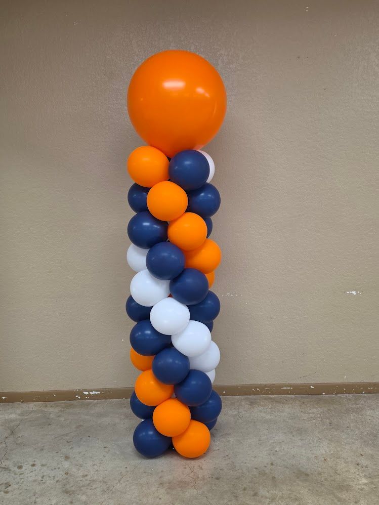Classic orange, blue, and white spiral balloon column rental for event decor in San Antonio and Wilson County TX