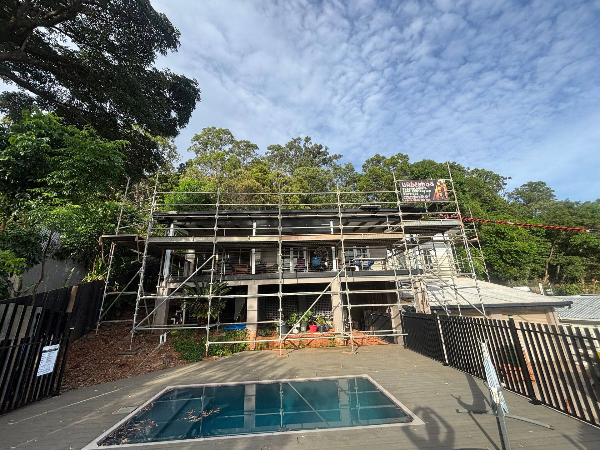 Building Under Construction With Scaffolding Against a Blue Sky — Underdog Edge Protection in Redlynch, QLD