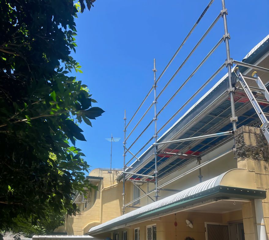 Scaffolding Next to a Building's Roof Under a Blue Sky — Underdog Edge Protection in Port Douglas, QLD