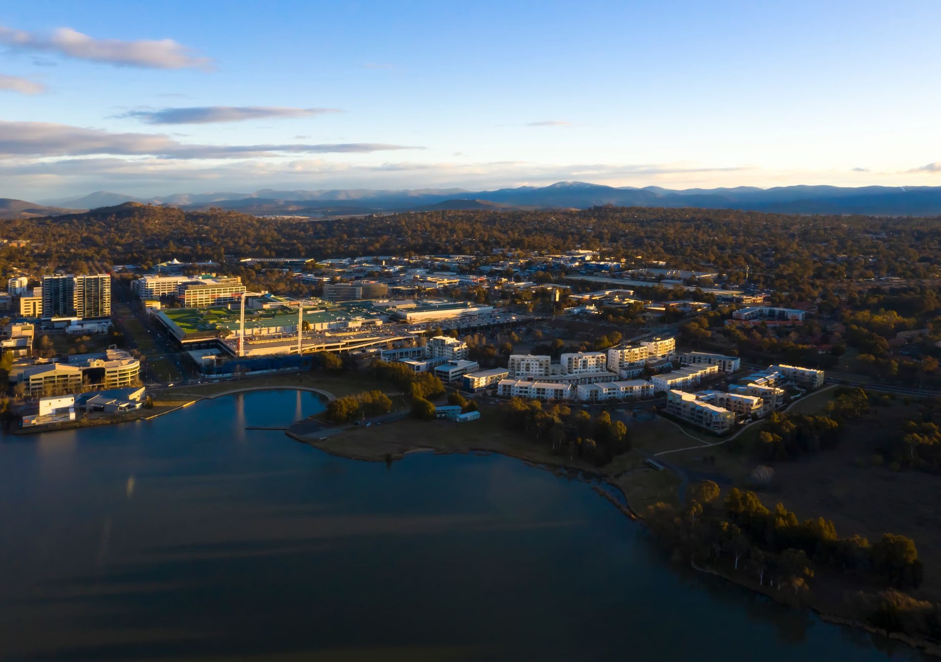 Aerial View of A City Bordering a Lake — J & H Plumbing and Gas in Belconnen, ACT