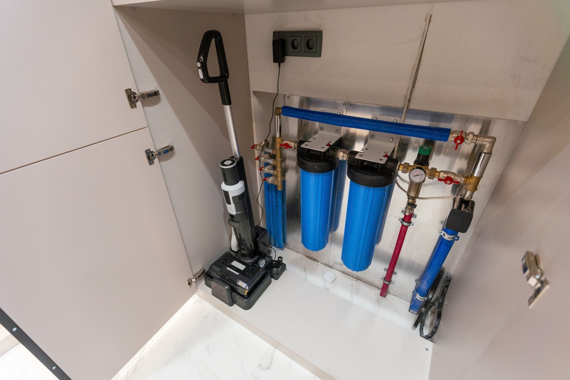 Water Filtration System with Three Blue Filter Canisters — J & H Plumbing and Gas in Holt, ACT
