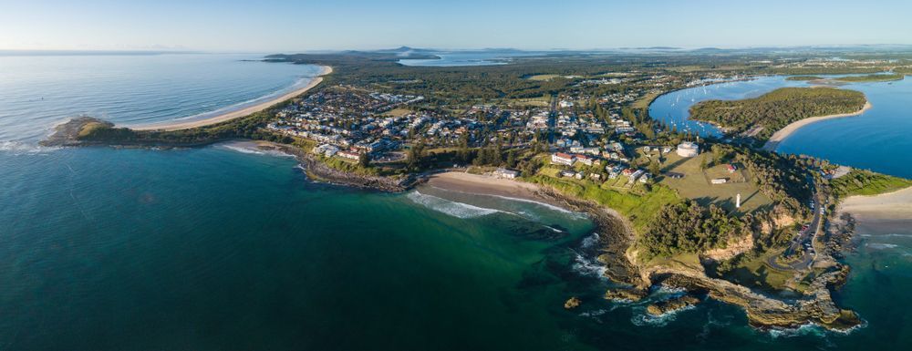 An Aerial View of a Small Island in the Middle of the Ocean — Doggy Diva Grooming In Yamba, NSW