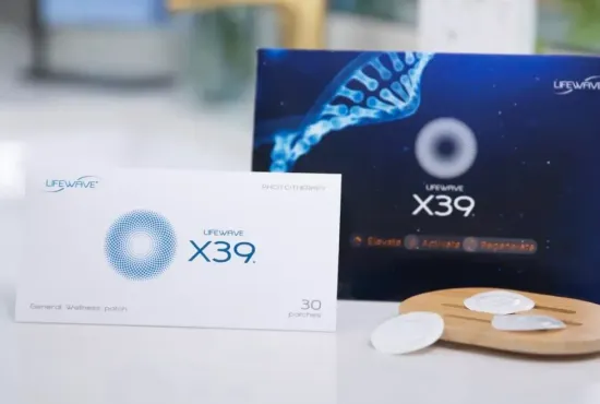 X39 supplement boxes, white and dark blue, with capsules on a wooden tray