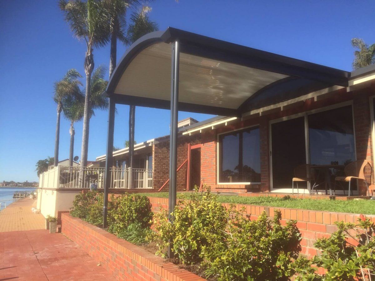 A house with a canopy over the front of it.
