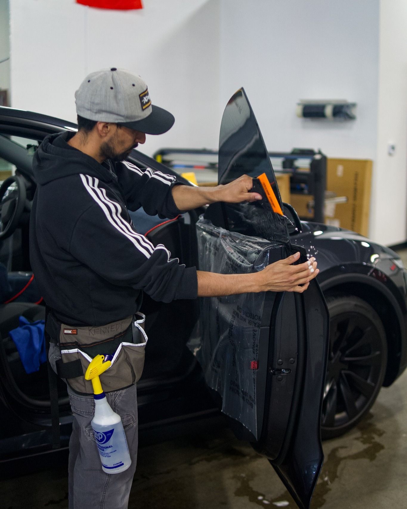 Clear Pro technician installing automotive window tint in Murrieta, CA