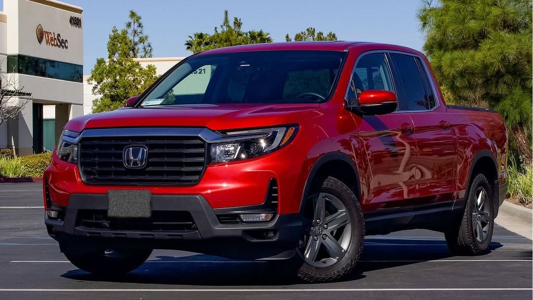 red vehicle with ceramic coating parked outside