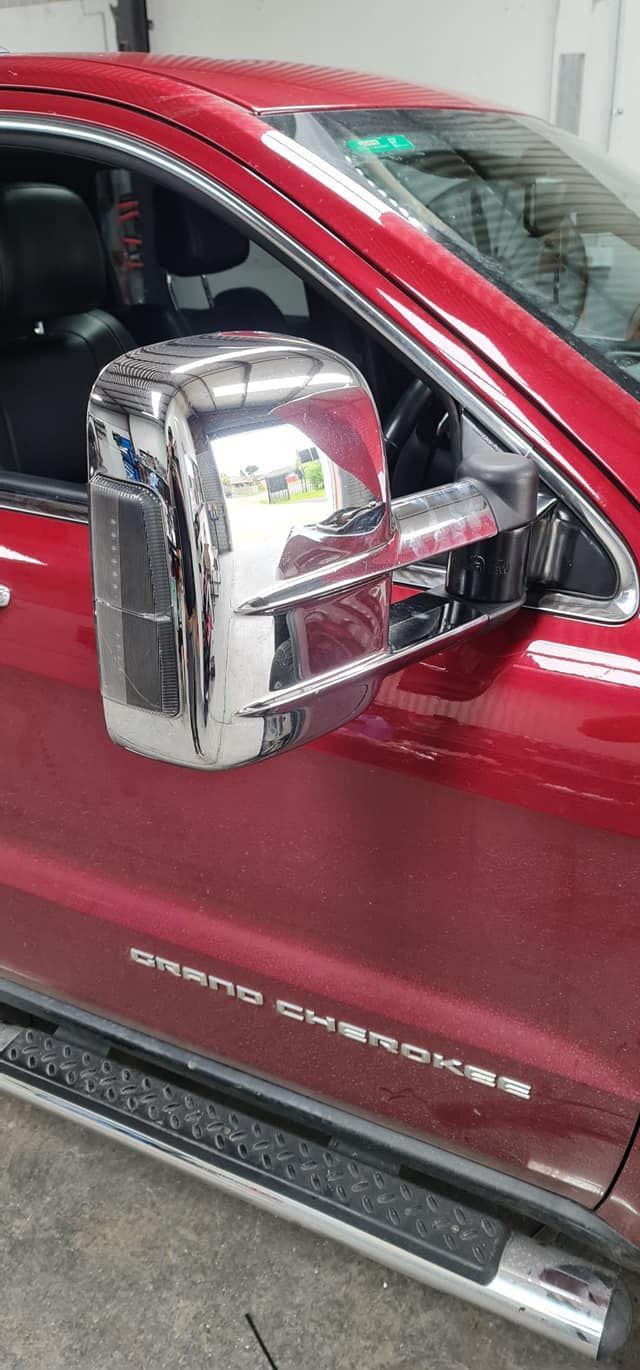 A Red Truck With Chrome Side Mirrors Is Parked In A Garage — Ballarat Auto Sparky in Sebastopol, VIC