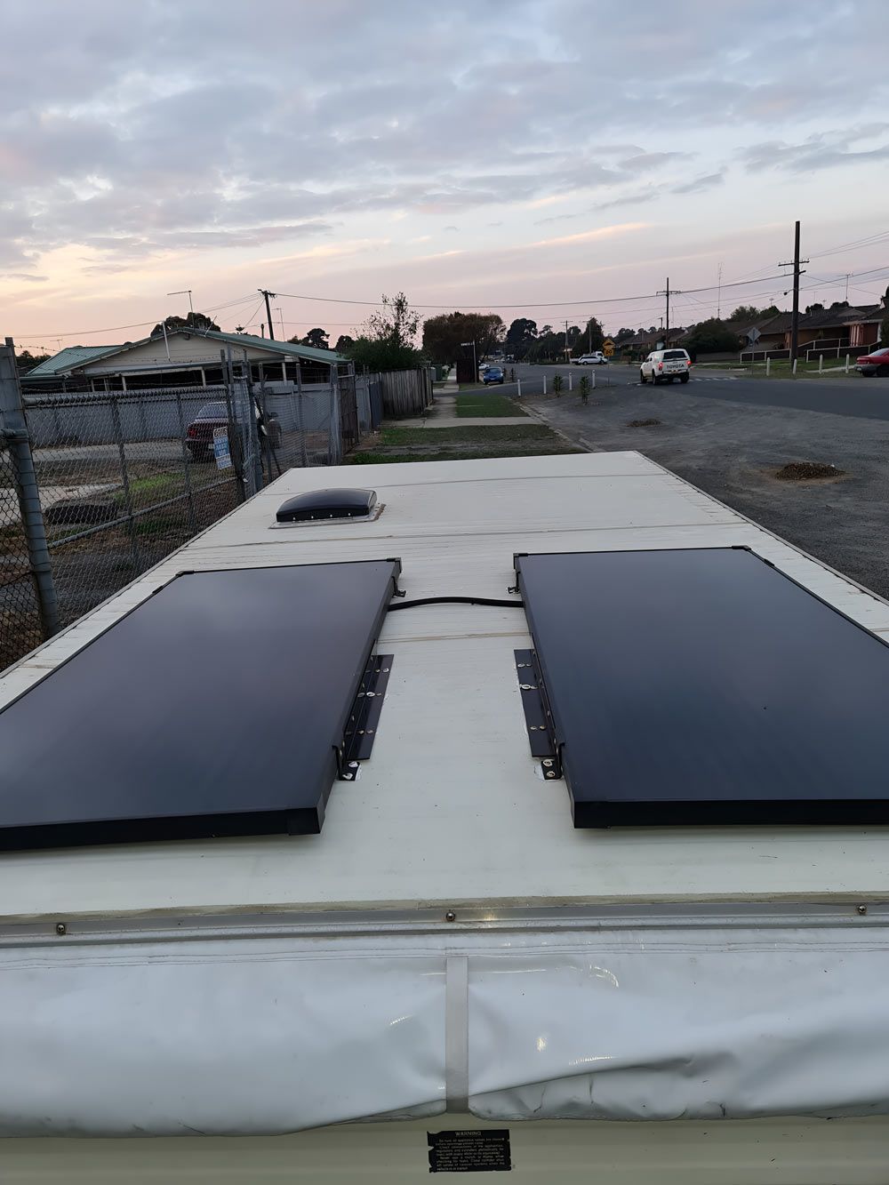There Are Two Solar Panels On The Roof Of A RV — Ballarat Auto Sparky in Sebastopol, VIC