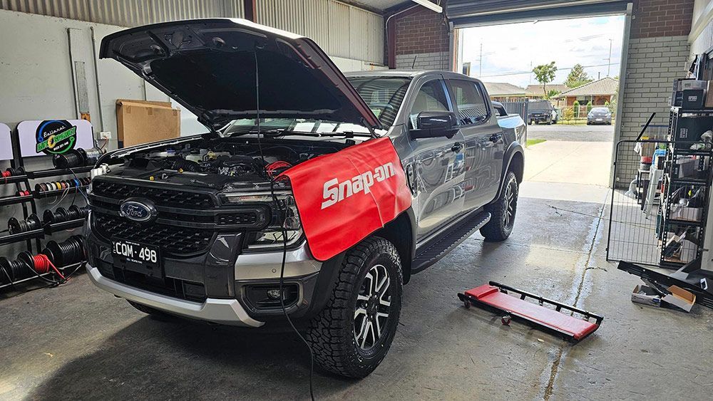 A Truck With The Hood Up Is Parked In A Garage — Ballarat Auto Sparky in Sebastopol, VIC