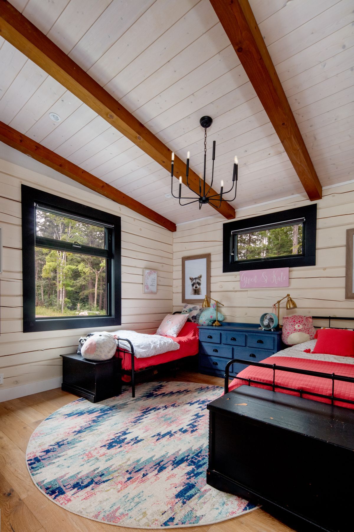 A bedroom with a king size bed and a wooden ceiling.