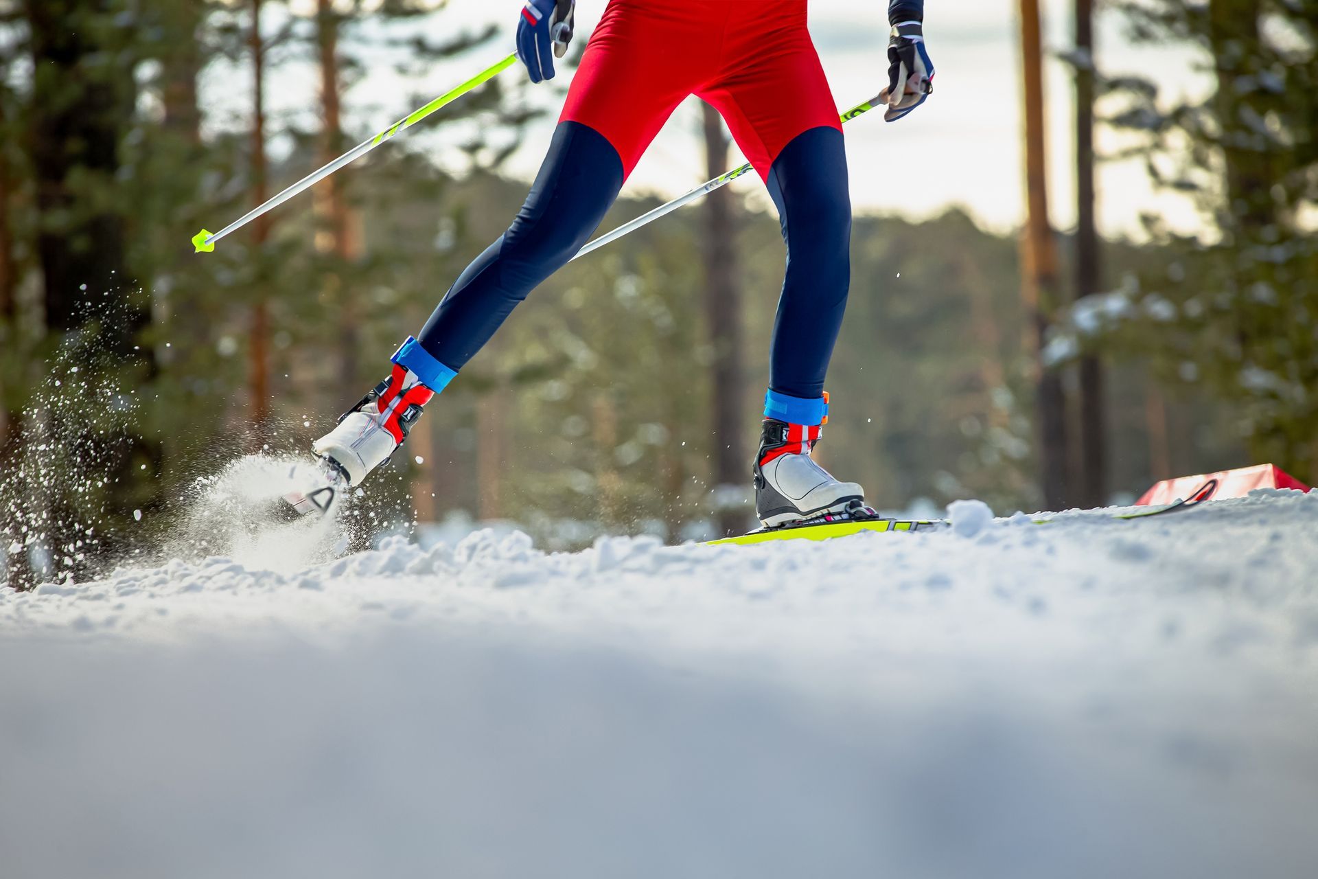 A person is cross country skiing in the snow.