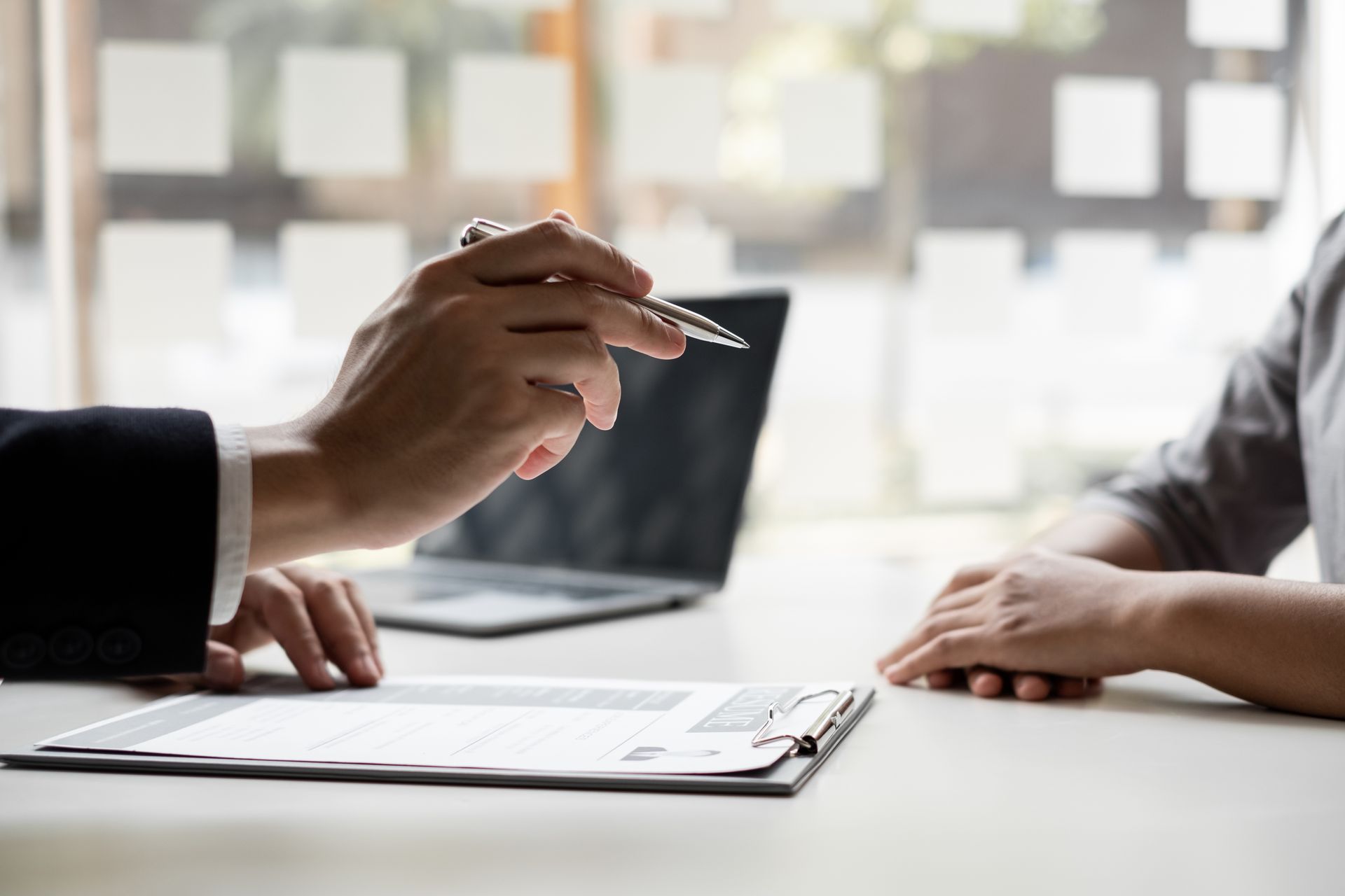 Workers comp consultation with a client reviewing claim documents