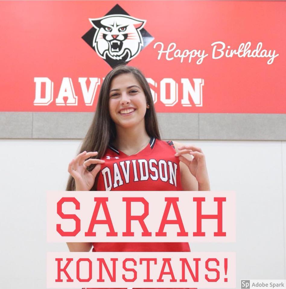 Sarah Konstans holding Davidson jersey; Happy Birthday! Red, black, white colors, smiling.