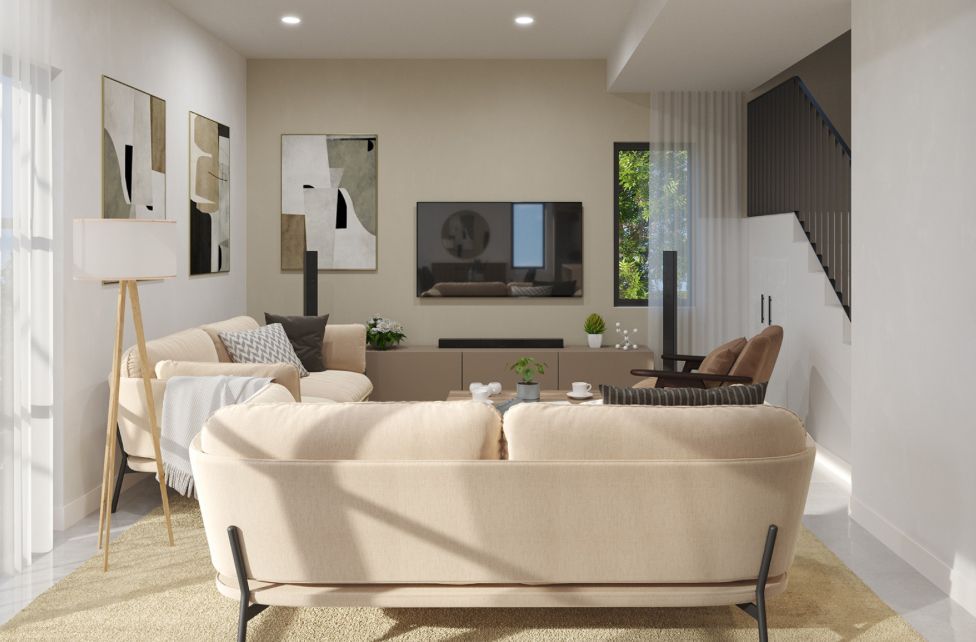 Bright modern living room with beige sofa, wall-mounted TV, and sunlight streaming in through large windows.