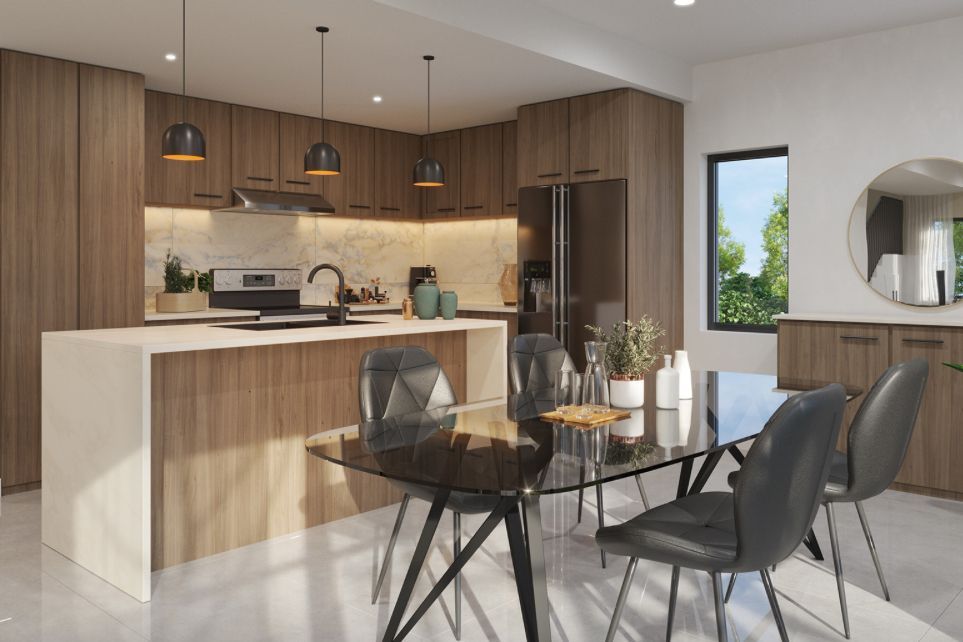 Modern open kitchen and dining area with wood cabinets, white island, and glass table in a bright apartment