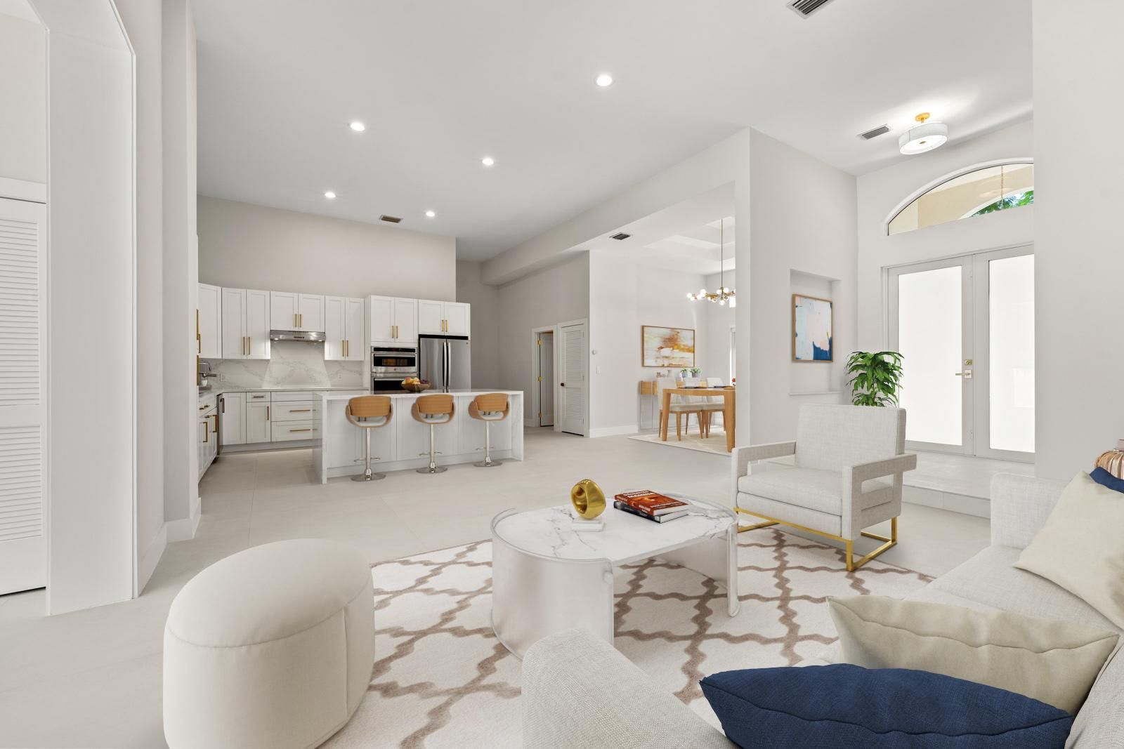 Bright white open-plan living room and kitchen with modern furniture and arched front door.