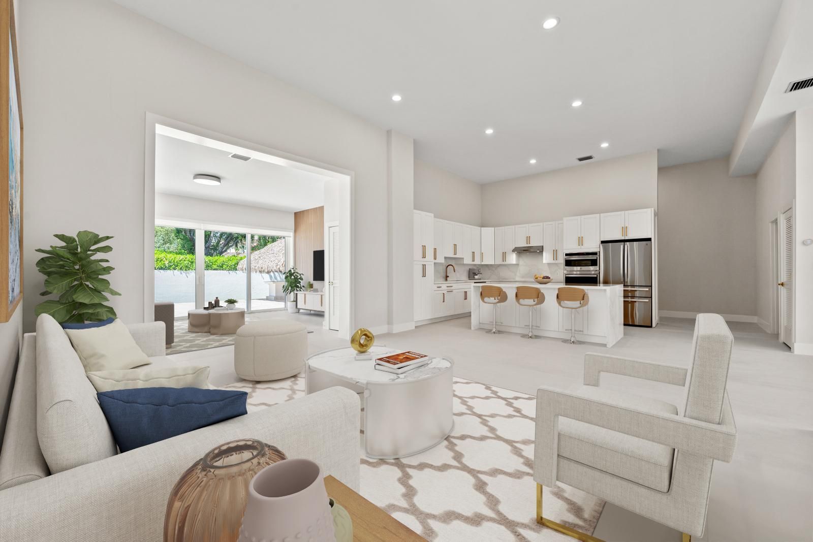 Bright open-plan living room and kitchen with white мебели, beige accents, and large windows