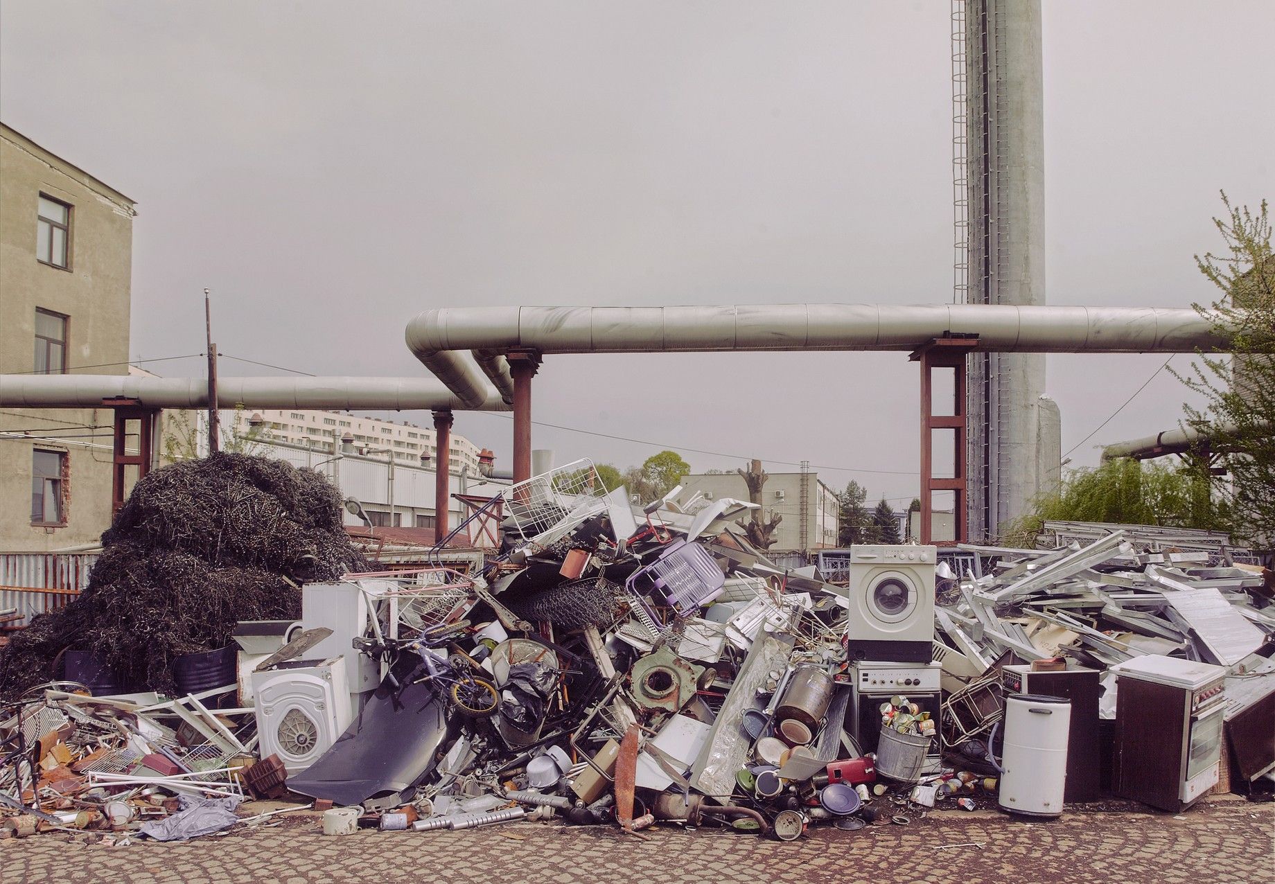 Washing machines, refrigerators, ovens and general junk lying on pile at a recycling center. Washing machines, refrigerators, ovens and general junk lying on pile at a recycling center.