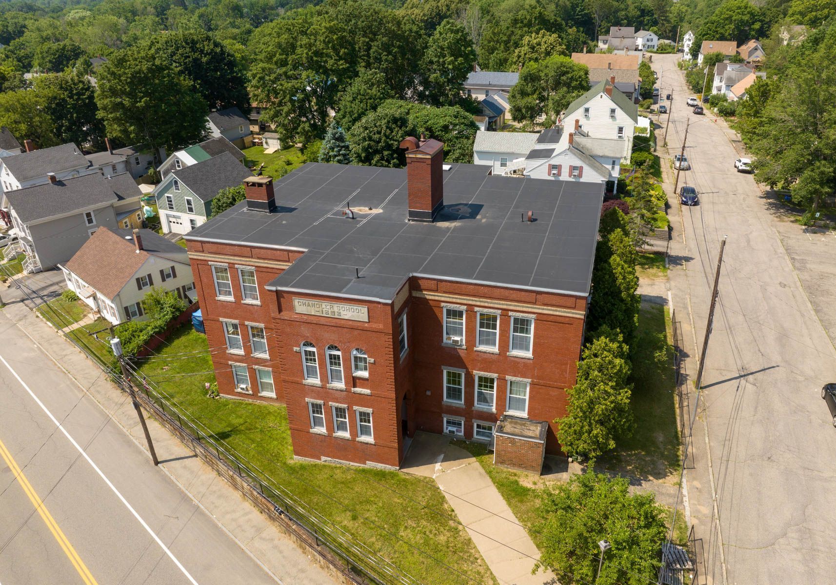 An aerial view of a large brick building 