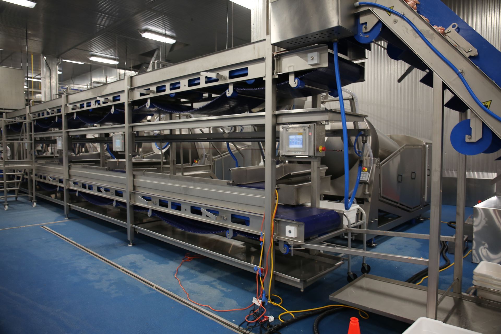 There is a conveyor belt in the middle of the room.