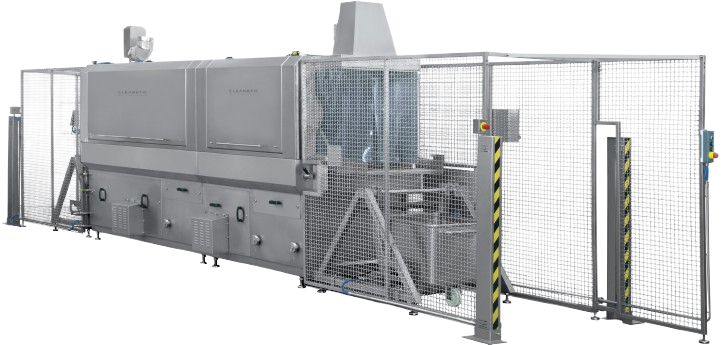 A large stainless steel machine is sitting inside of a cage.