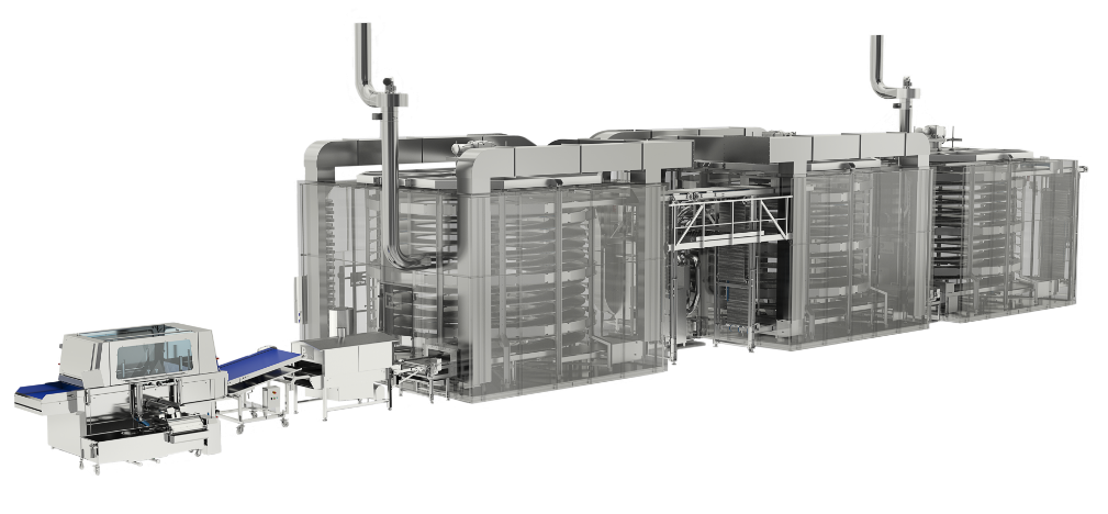 A large stainless steel machine is sitting on top of a conveyor belt.