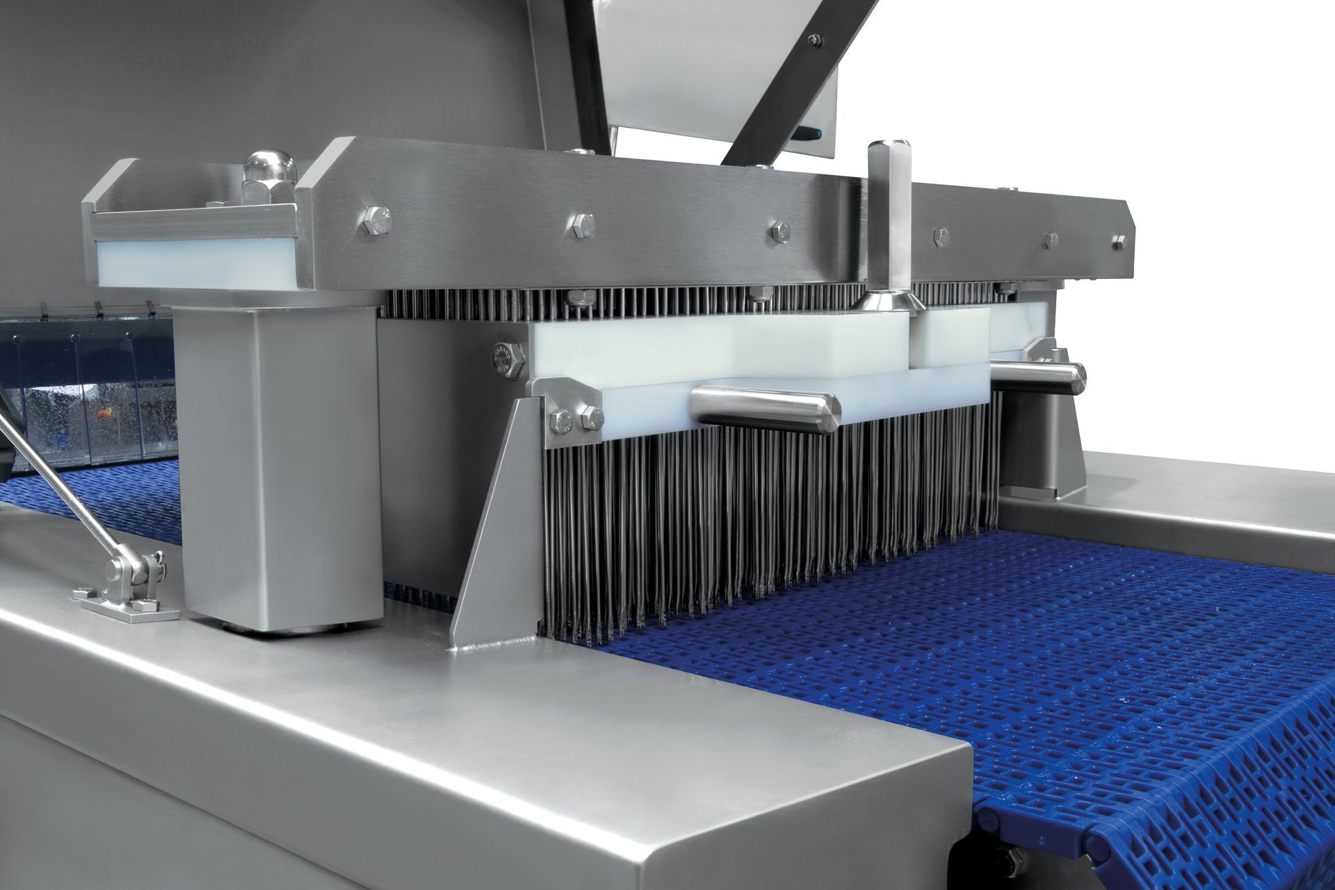 A machine with a blue conveyor belt and brushes on it.