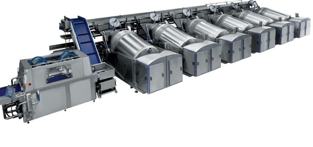 A large machine is sitting on top of a conveyor belt.