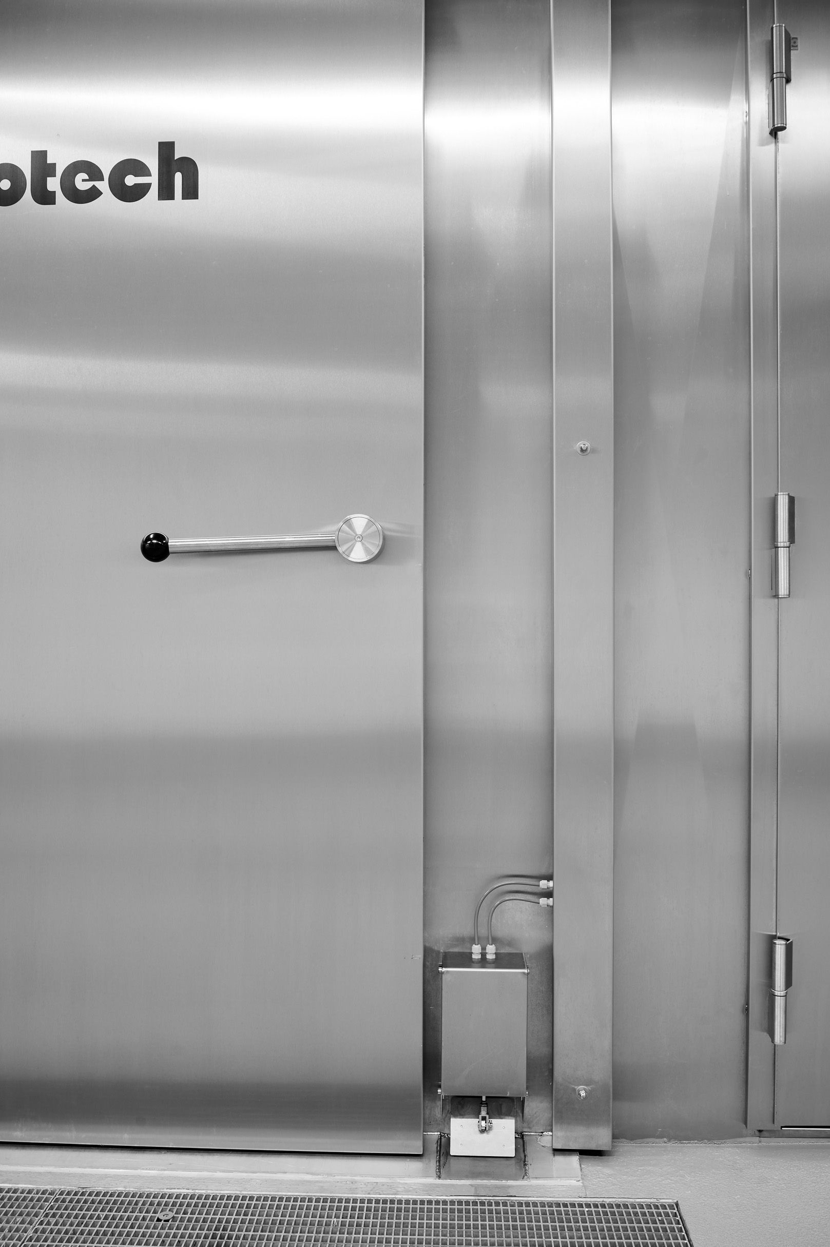 A stainless steel door with the word otech on it