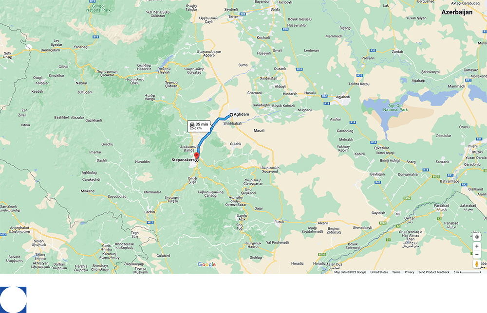 Map showing a route from a red marker in a valley to a town in a mountain area.