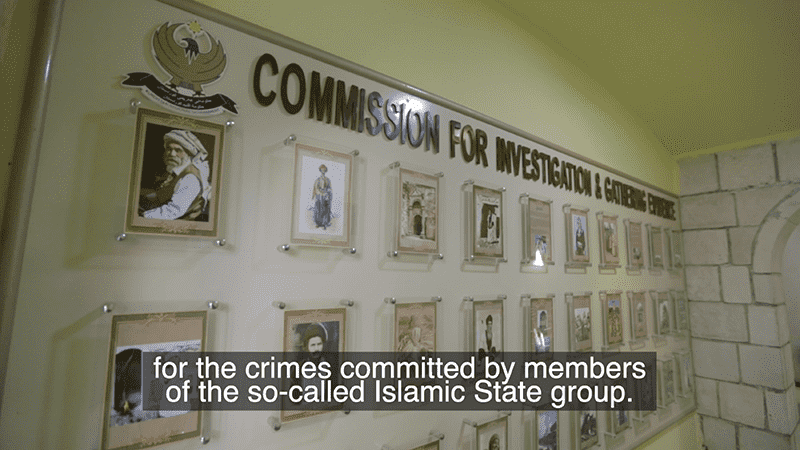 Wall of framed portraits under the text “Commission for Investigation,” shown in press release about Yazidi led documentary
