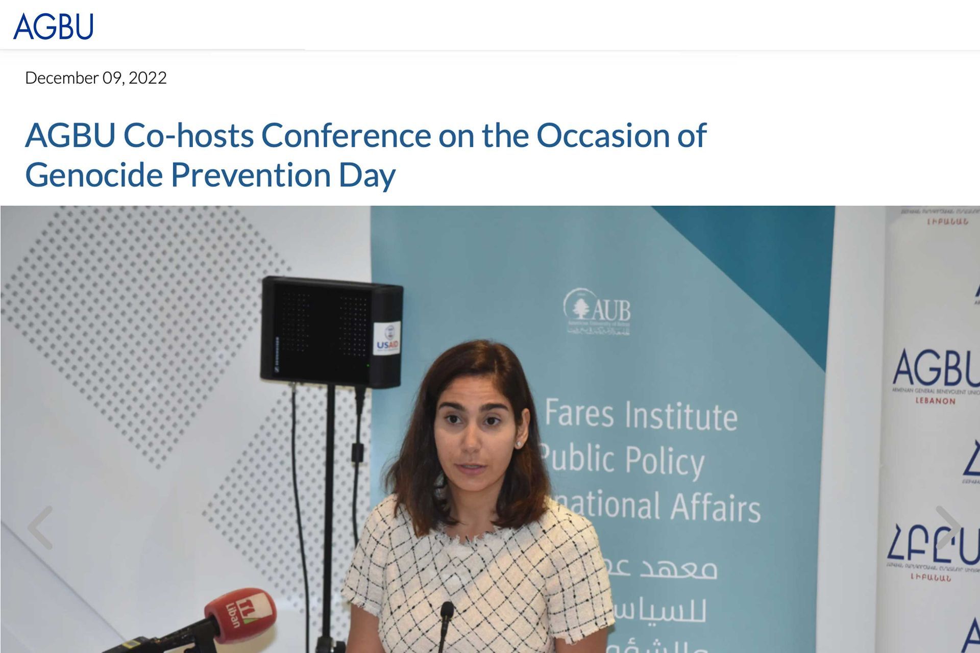 AGBU press feature showing woman speaking at a podium with AGBU banner behind her relates to a genocide prevention conference