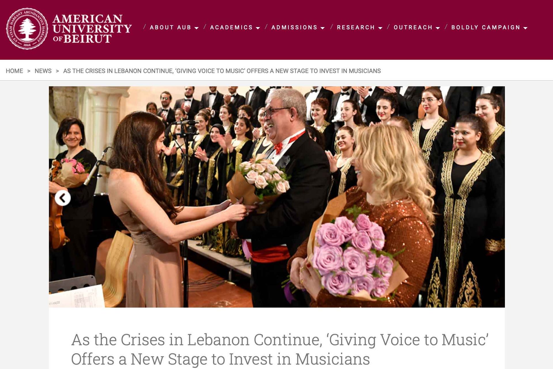 AUB feature; Lynn Zovighian giving flowers to Barkev Taslakian and Maria Mattar. Fayha National Choir in the background.