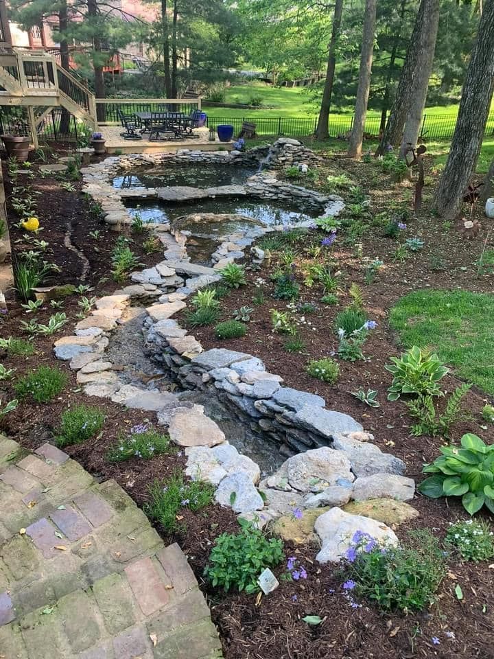 There is a waterfall in the middle of the garden.
