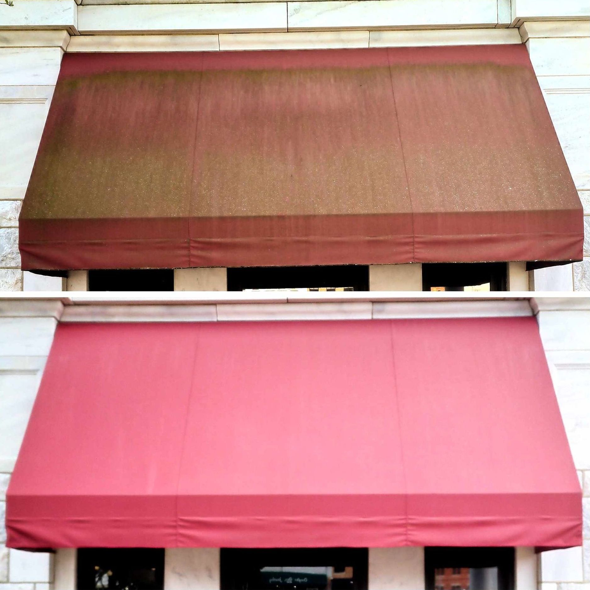 A red awning is on the side of a building