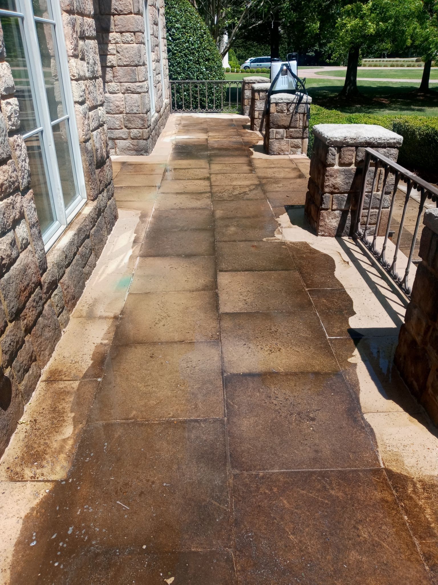 Pressure washing stone walkway