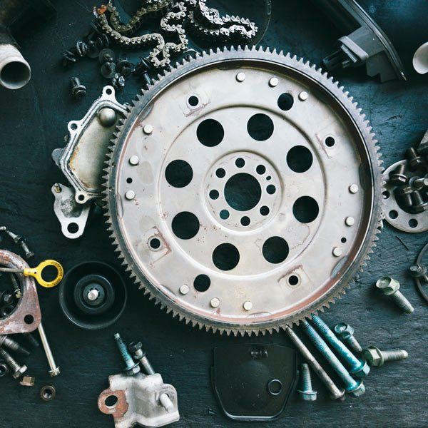 A Gear is Surrounded by Other Parts on a Table — Ballina Automatics in Ballina, NSW