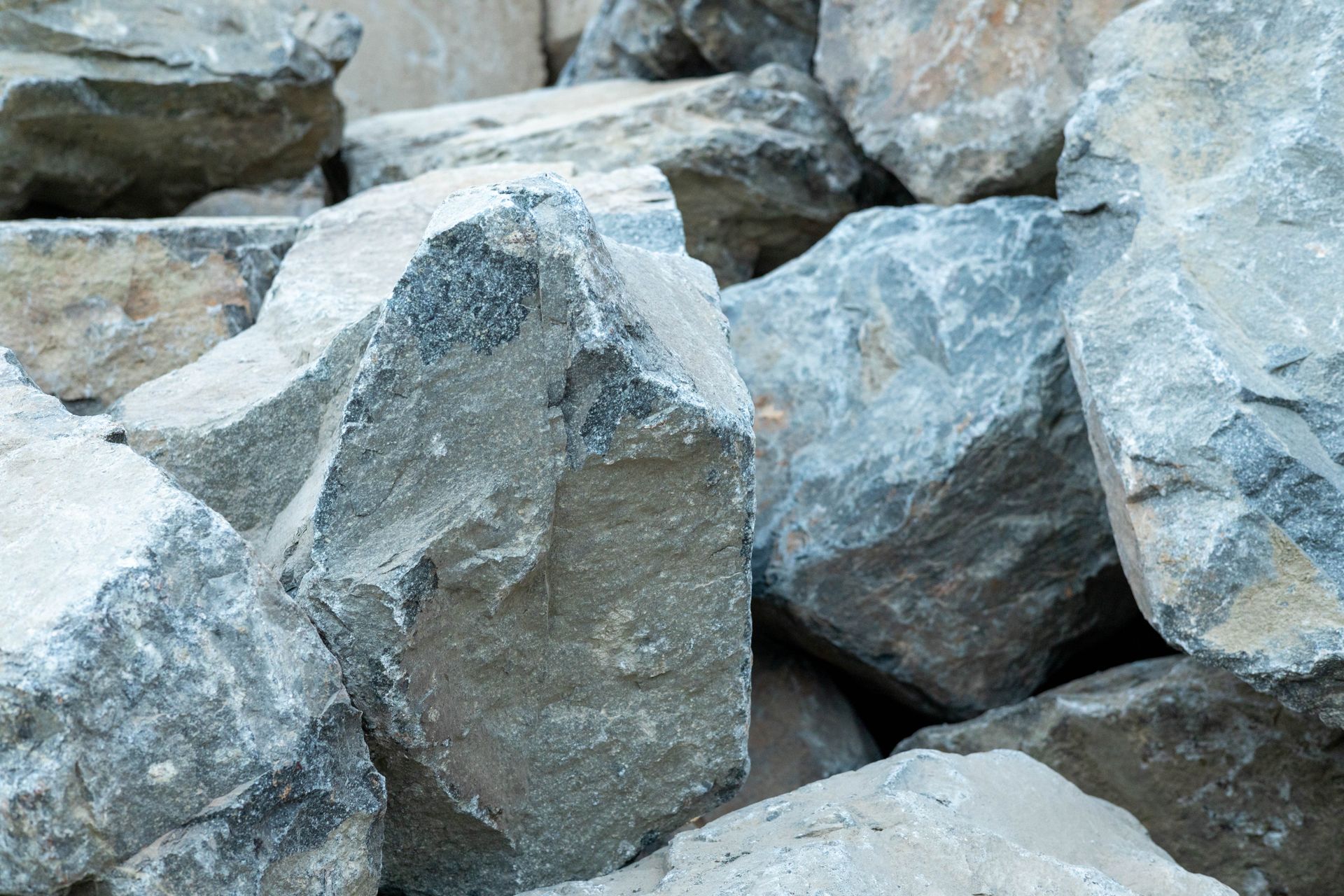 Pile of gray rocks and stones stacked together