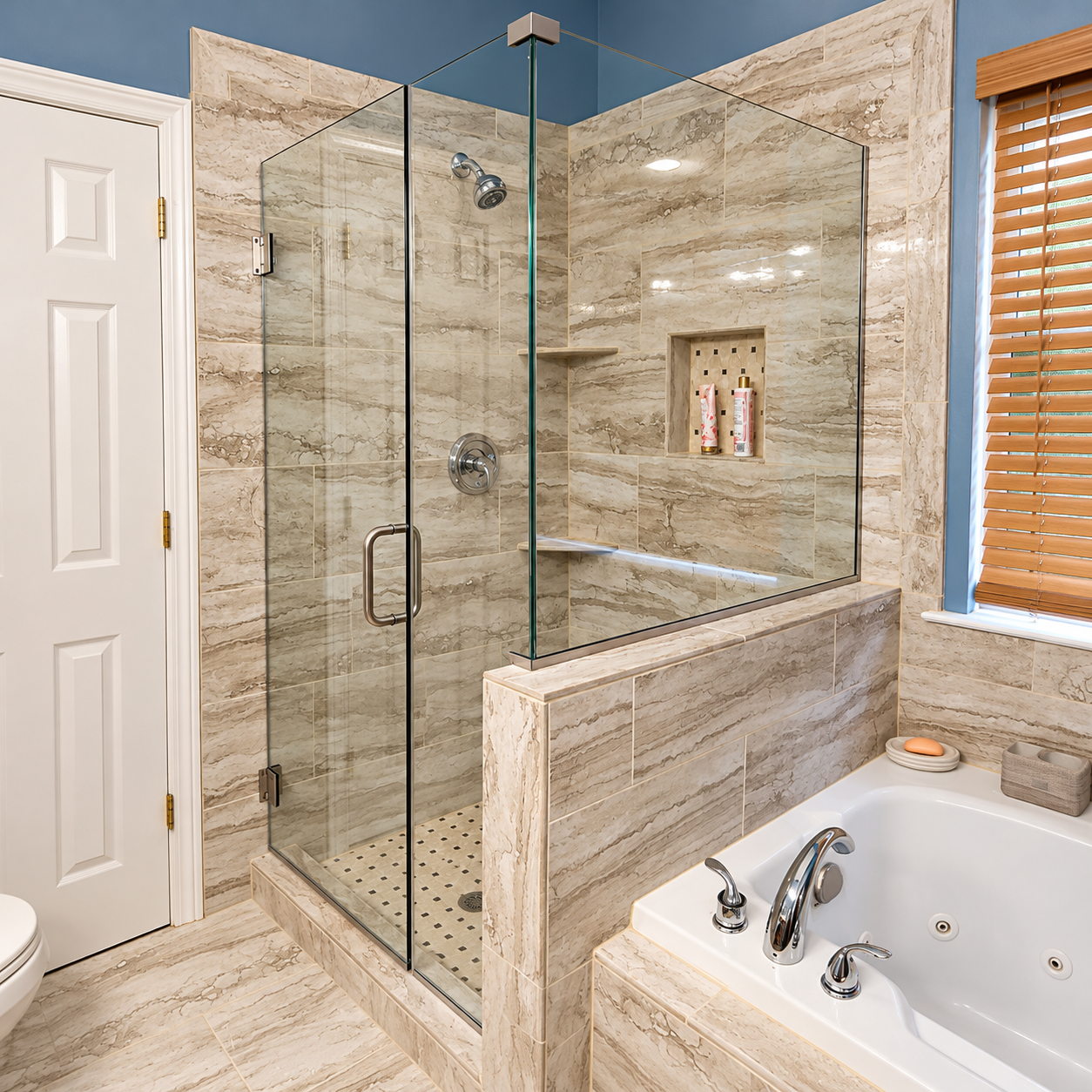 Modern bathroom with glass shower, beige stone tile, and a white soaking tub beside a window