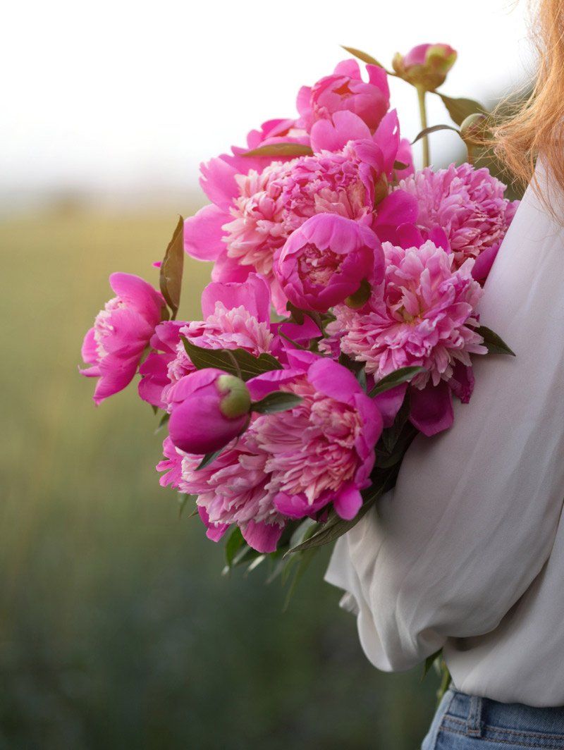 woman holding flowers in friendswood texas
