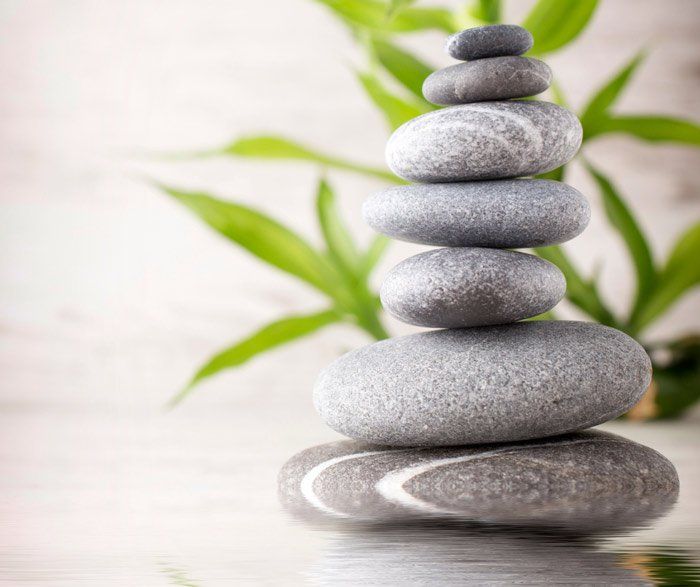 a stack of rocks sitting on top of each other on a table .