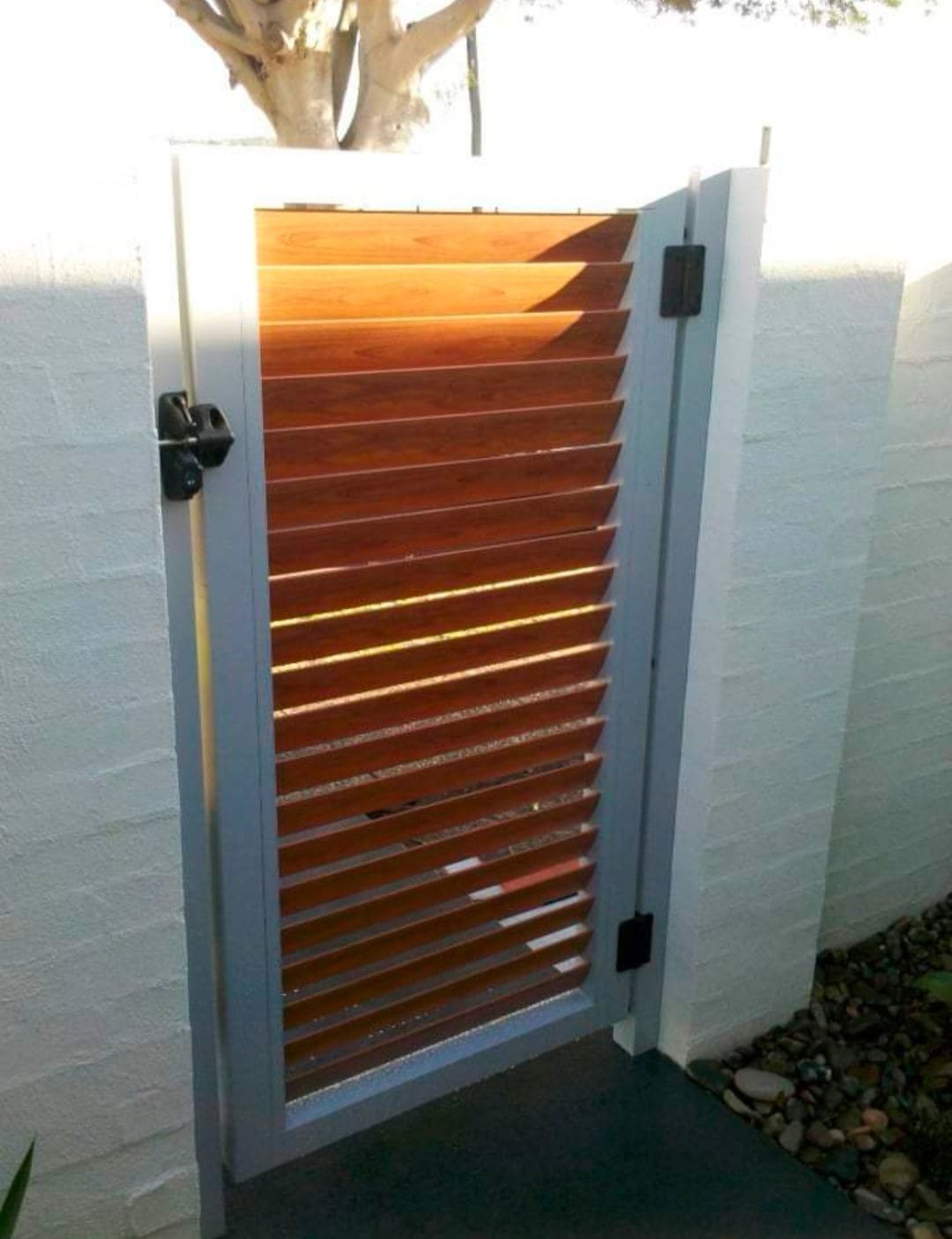 A White Brick Wall With Safety Side Aluminium And Wooden Gate — Decorative Aluminium Works In Maitland, NSW