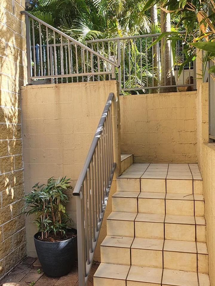 Set Of Stairs Leading Up To A Balcony With A Metal Railing — Decorative Aluminium Works In Central Coast, NSW