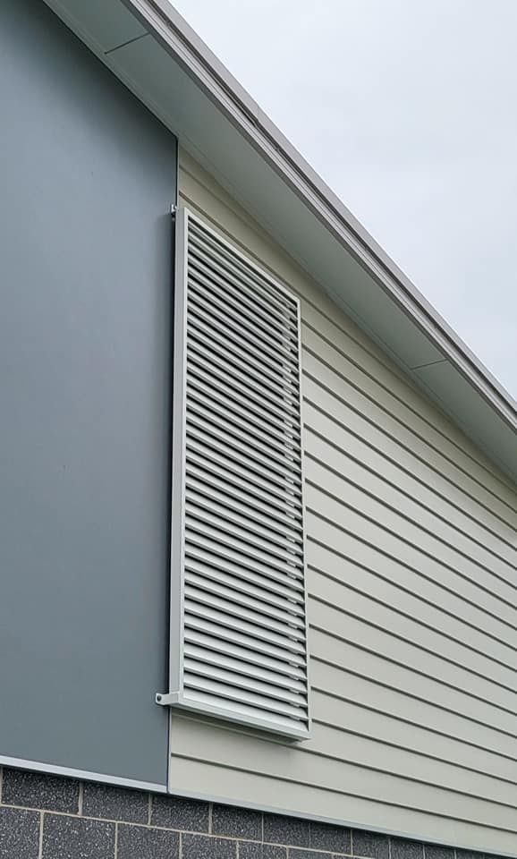 Close Up Of A Window Aluminium Privacy Screen On The Side Of A House — Decorative Aluminium Works In Lake Macquarie, NSW