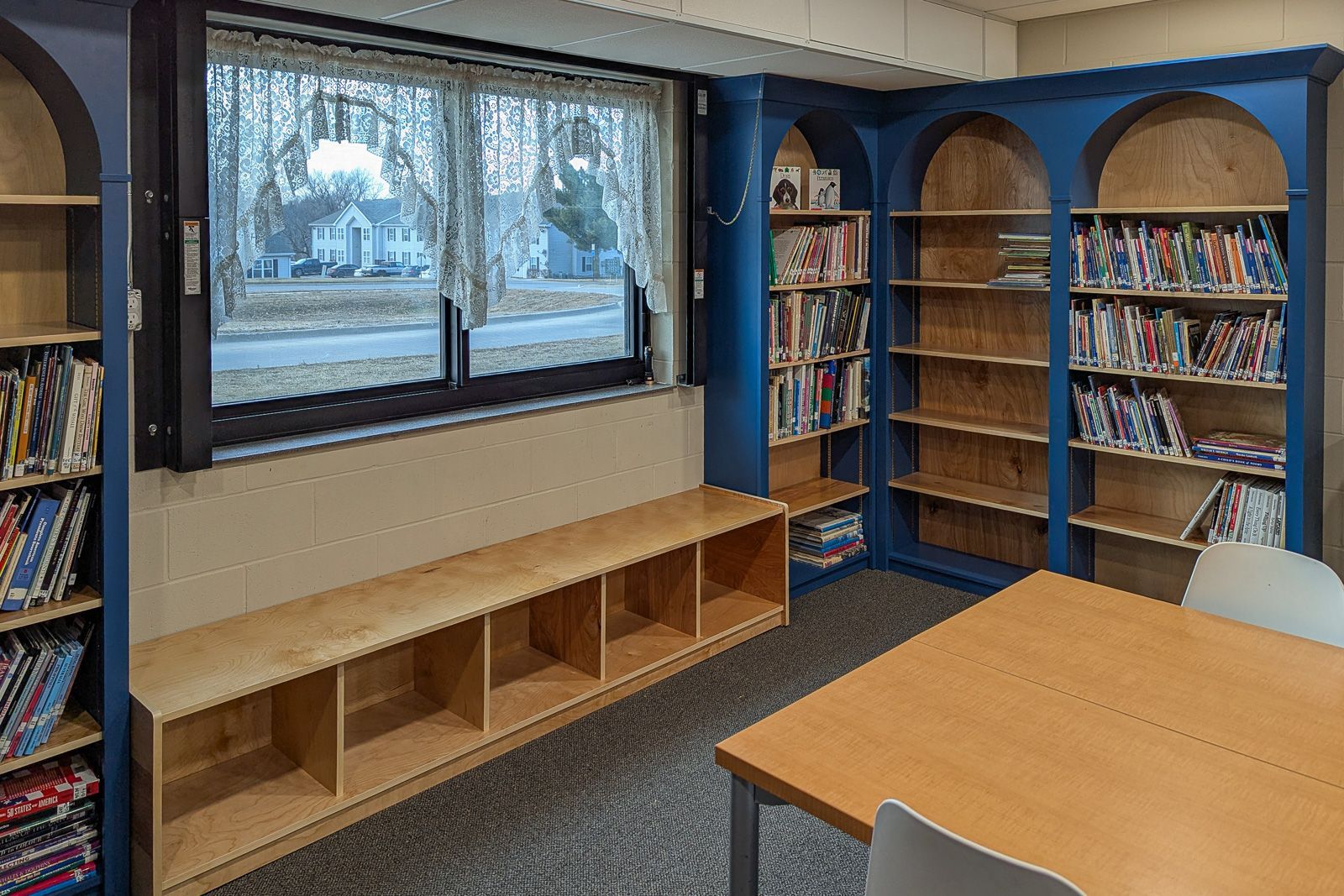 Baltic birch library shelving, another view of the arched reading room alcoves. Marshalltown, Iowa.