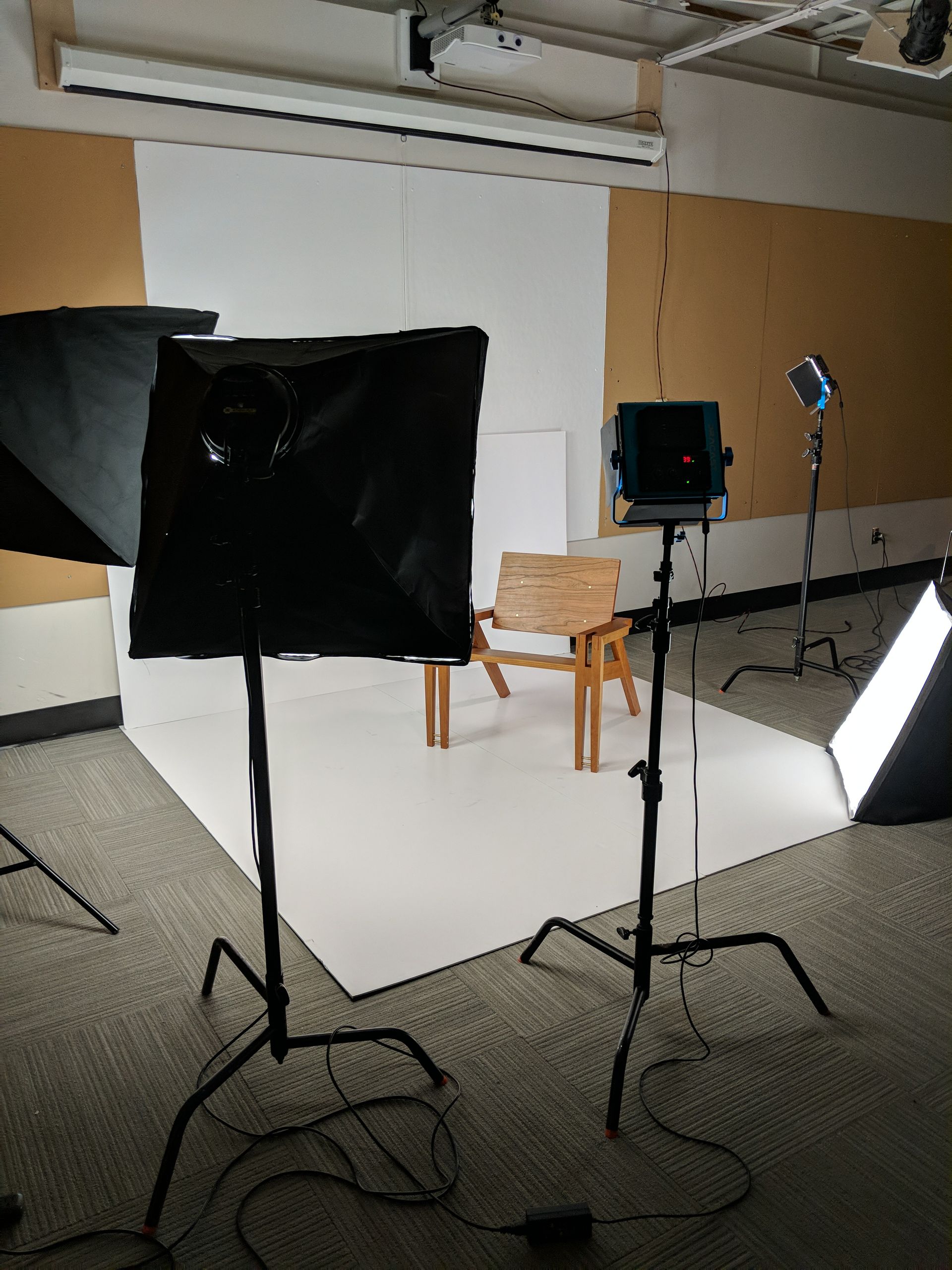 Studio photoshoot of handcrafted wooden chair under softbox lighting by Crow and Timber.