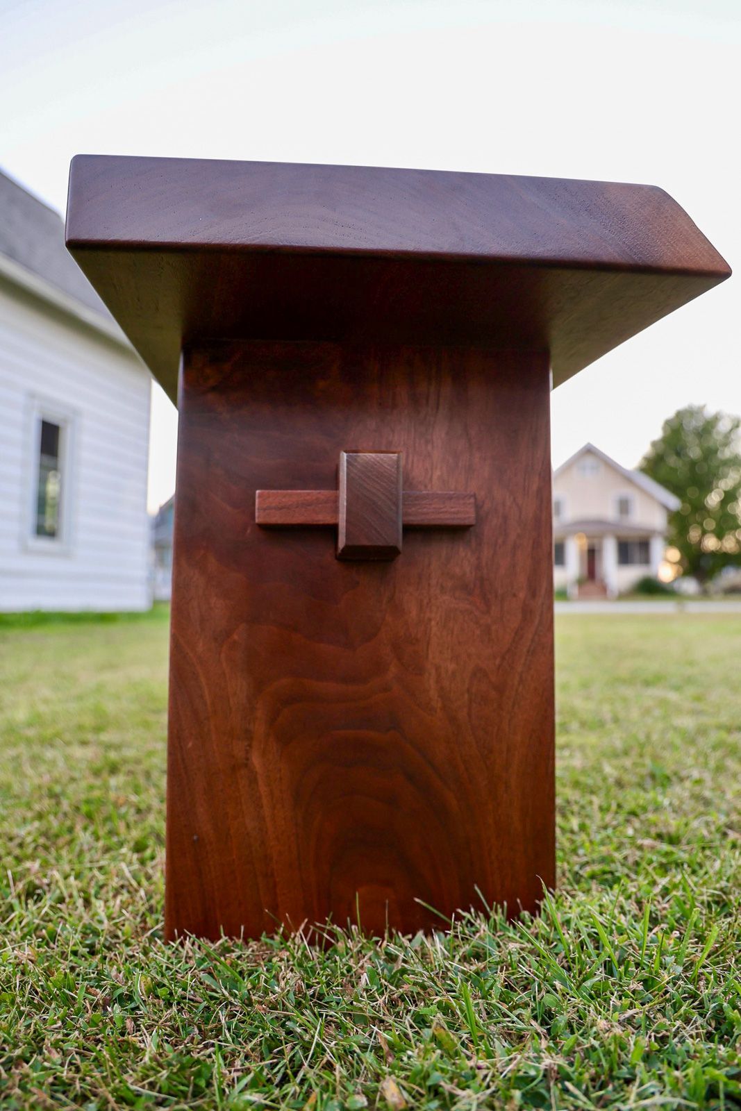 Black walnut Backbone bench, alternate view showing the live edge top and slab legs. St. Charles, Iowa.