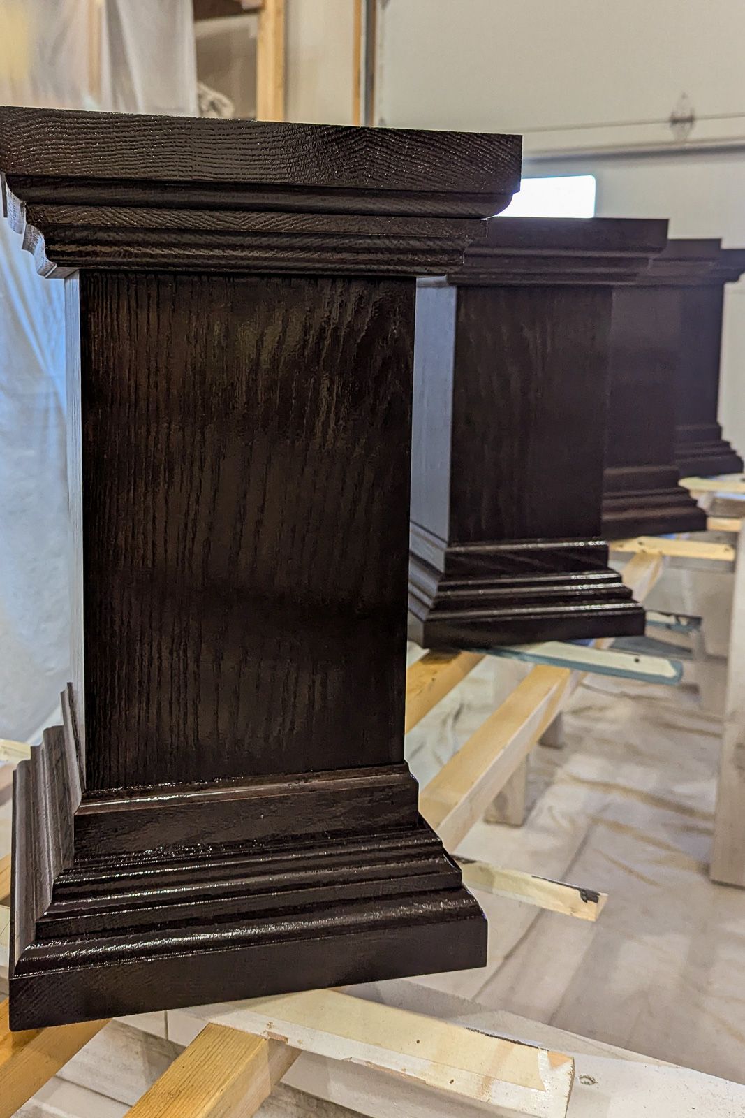 White oak plinth base, alternate view of the stepped molding and proportions. Nevada, Iowa. 