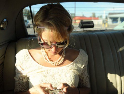 ethnographic research woman texting in a car
