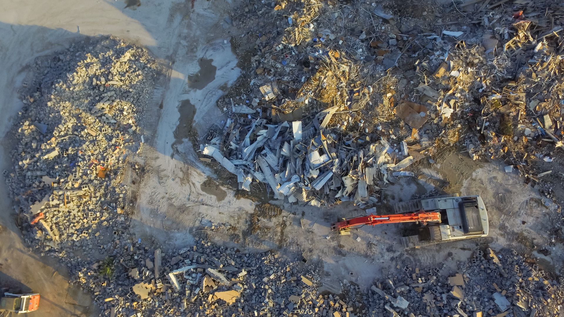 Aerial view of abandoned site demolition and hazardous debris cleanup operations